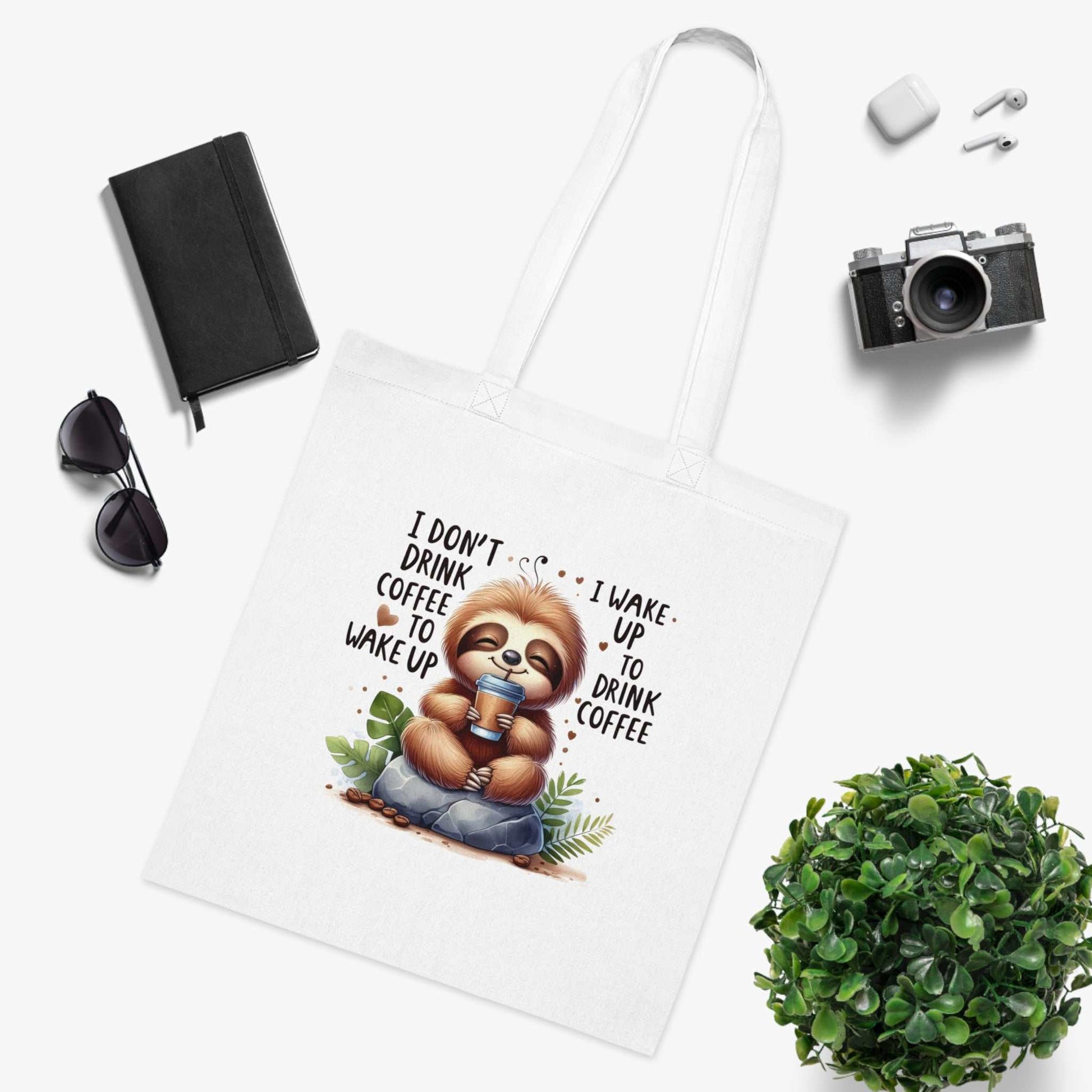 Cotton tote with cute sloth design, perfect for carrying essentials, available in six colors.