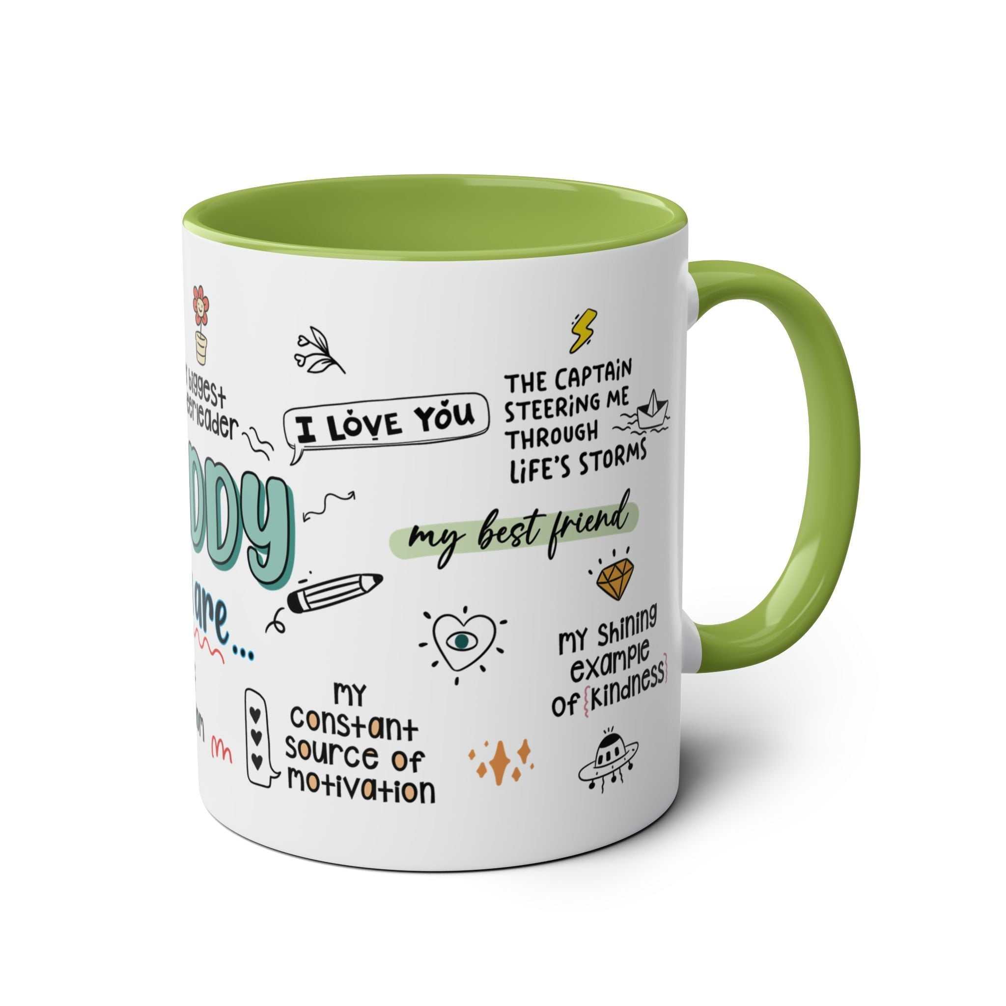 Fathers Day gift mug with colorful graphics and messages, green handle, and interior.