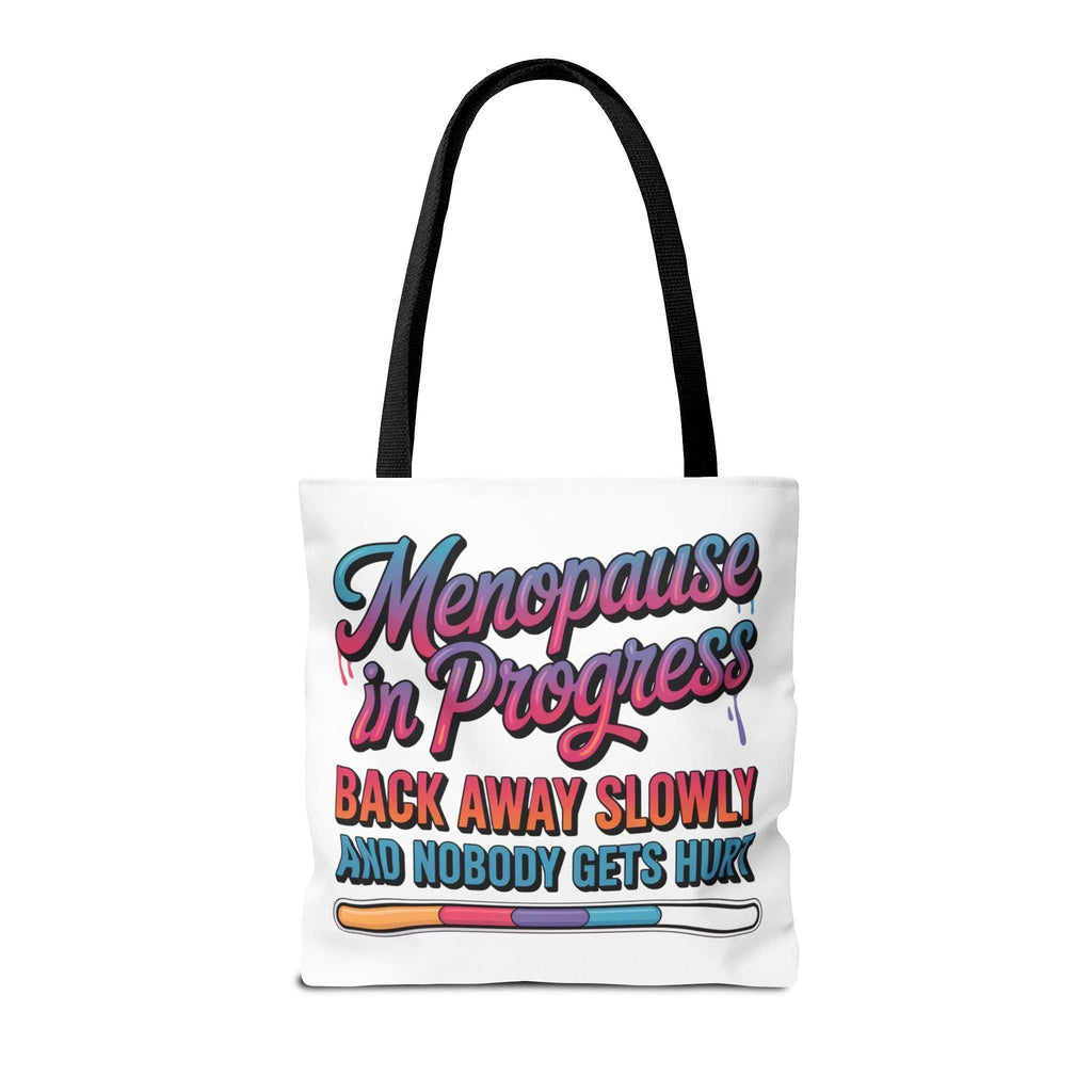 Menopause in Progress tote bag with cheeky design, durable spun polyester, multiple sizes, and handle color options