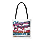Menopause in Progress tote bag with cheeky design, durable spun polyester, multiple sizes, and handle color options