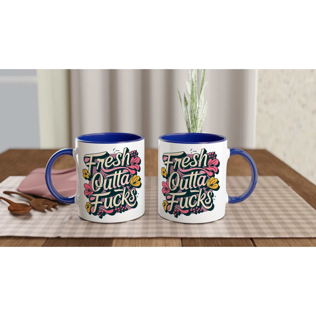 Fresh Outta Fucks Fun Mug on table with colorful design and blue handle