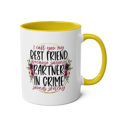 Partner in Crime Coffee Mug with humorous text, yellow handle, and floral design, 11oz ceramic, microwave and dishwasher safe.