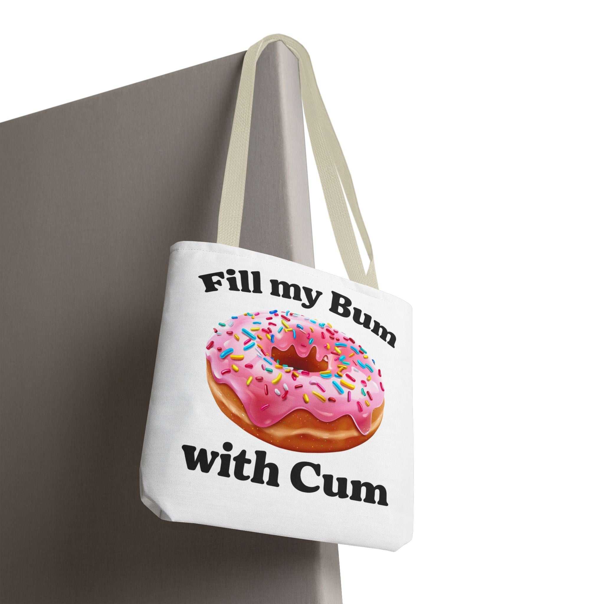 Cheeky provocative donut tote bag with durable spun polyester and multiple handle colors, available in three sizes