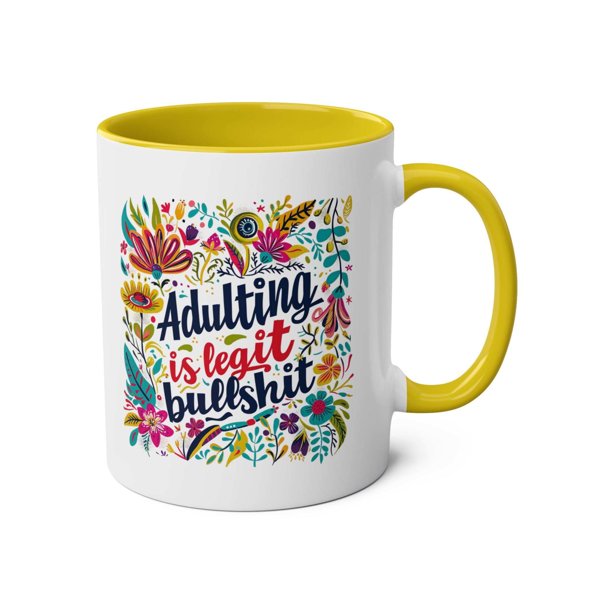 Colorful "Adulting Is Bullshit" coffee mug with floral design and yellow handle.