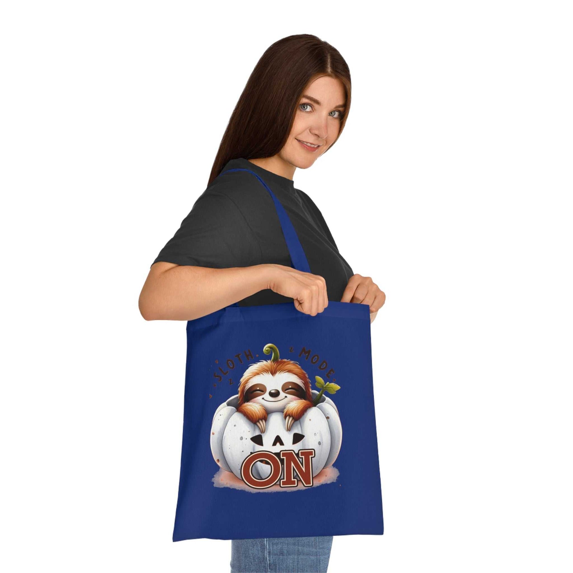 Cotton tote bag with cute sloth design in vibrant colors.