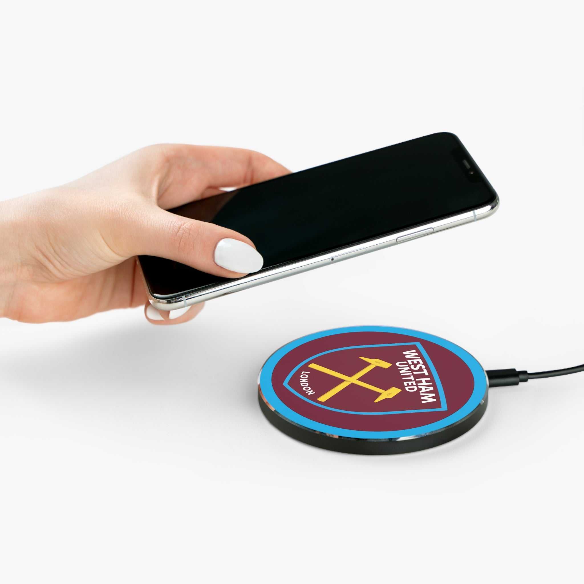 West Ham Utd Fc wireless charger with claret and blue colors and crossed hammers crest, 10W fast charging, aluminum casing, and non-slip base.