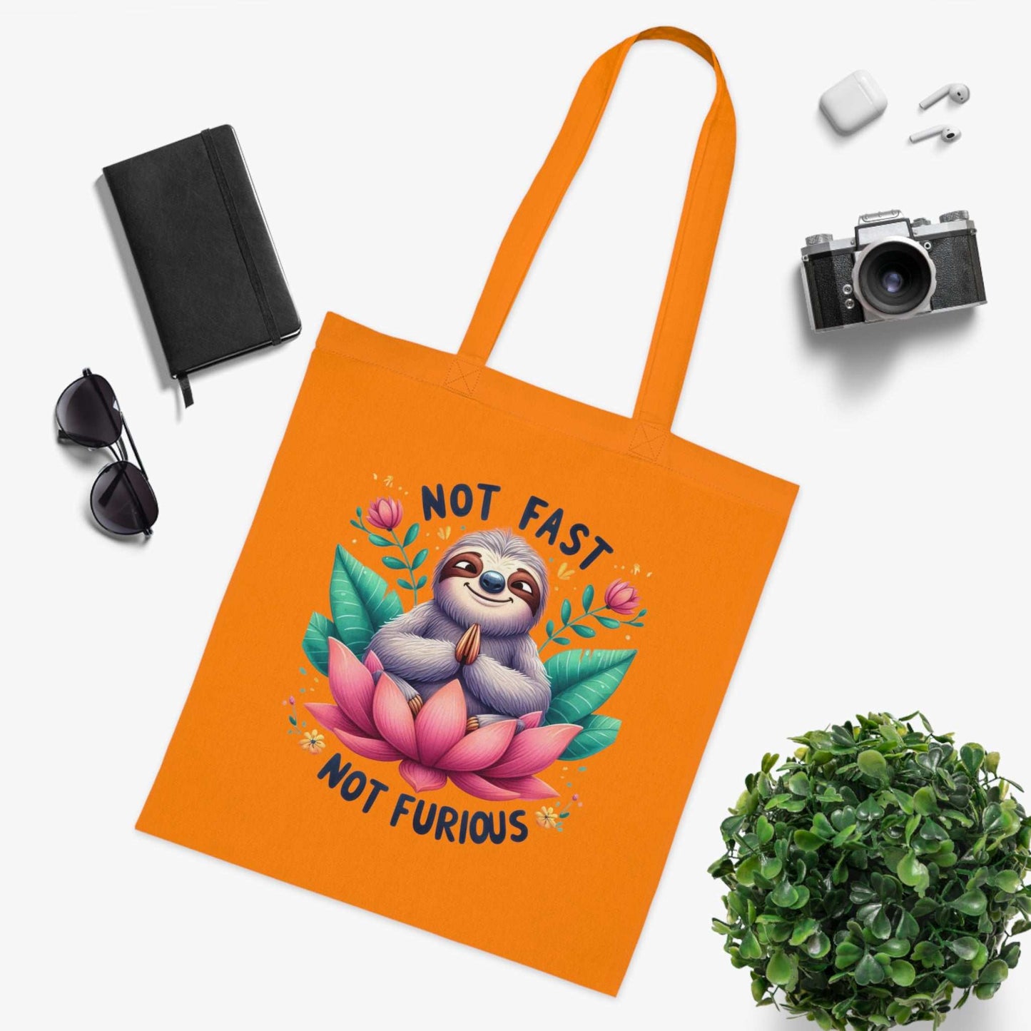 Cute sloth design cotton tote bag with vibrant colors, perfect for shopping and errands.