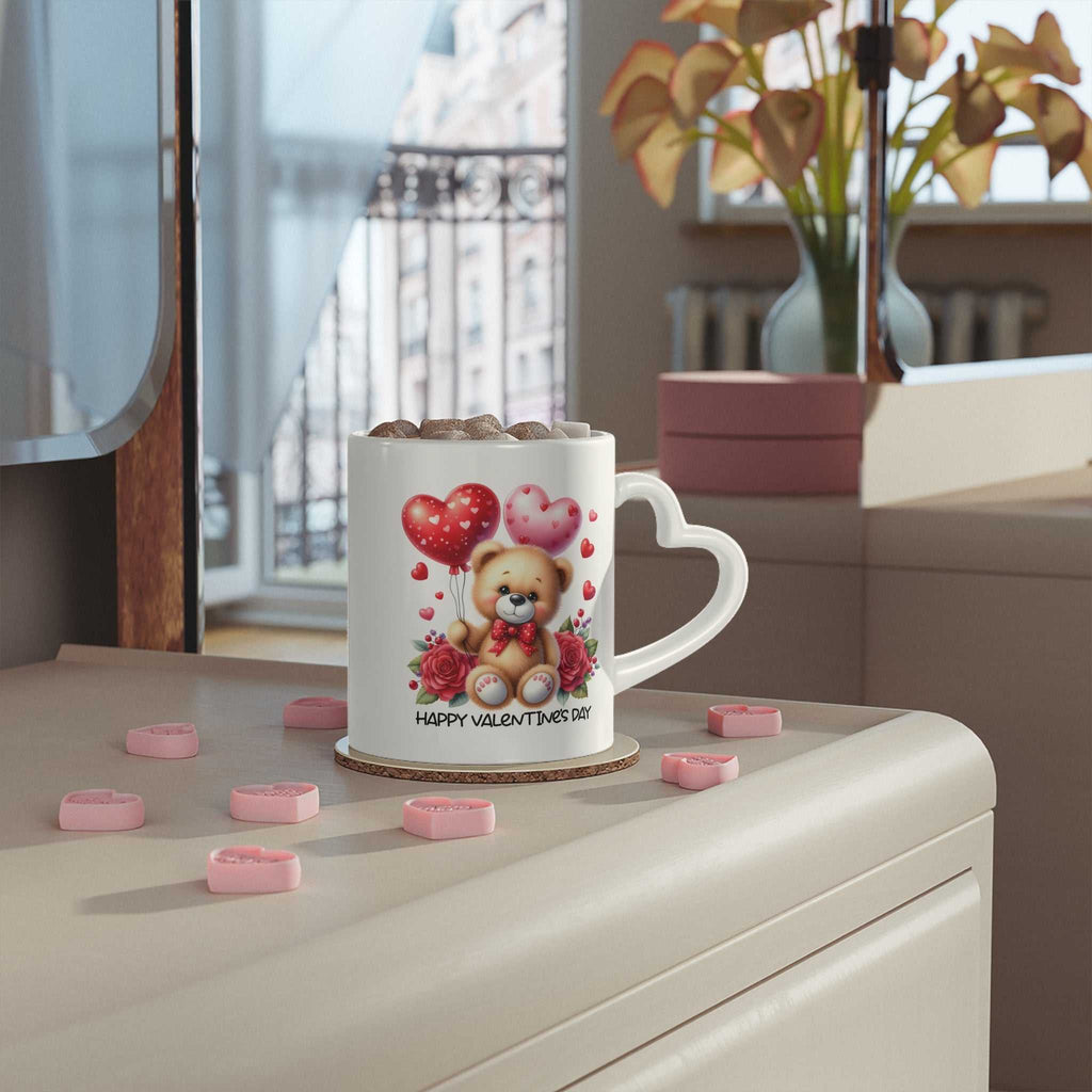 Cute Valentines Day mug with heart-shaped handle, vibrant design, ceramic, 11oz, glossy finish.