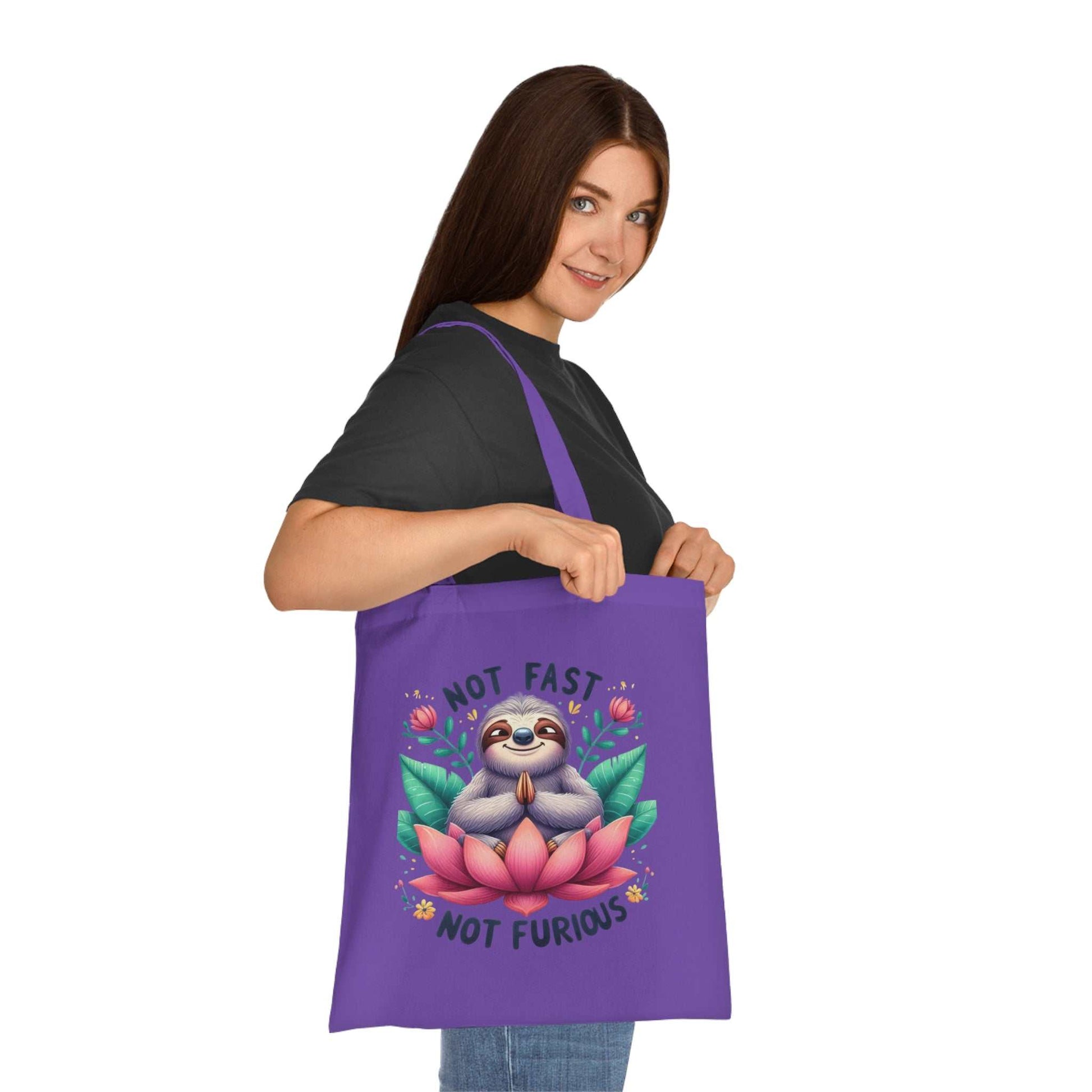 Cotton tote featuring a cute sloth design, perfect for sloth lovers; made of 100% durable cotton with vibrant colors and reinforced handles.