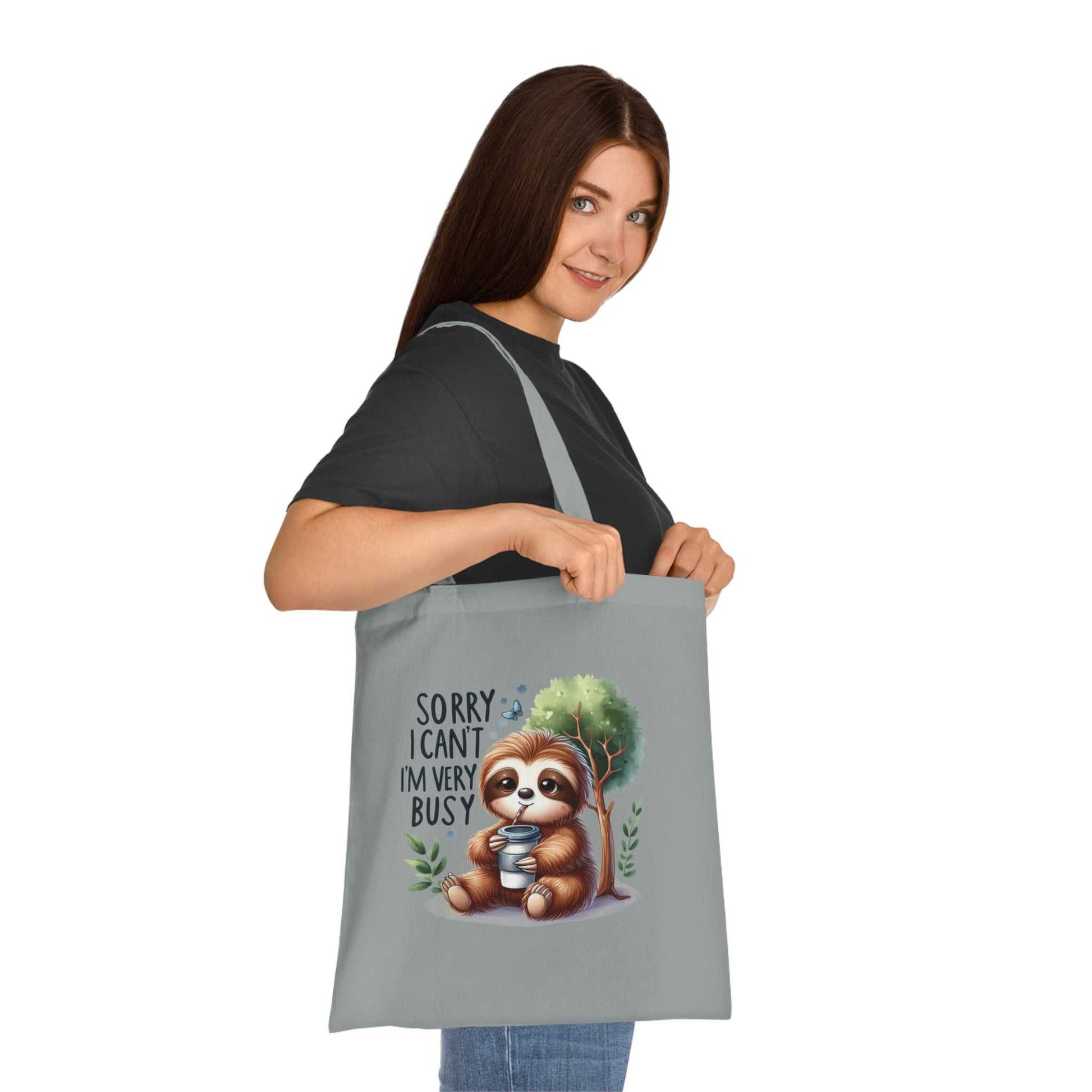 Cotton tote bag featuring cute sloth design, perfect for shopping and errands.