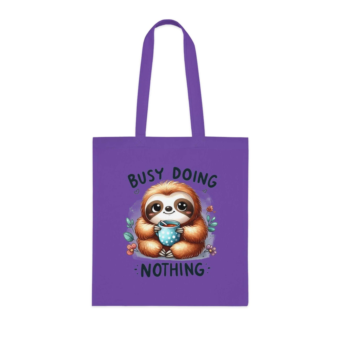 Cotton tote bag with cute sloth design, purple color, "Busy Doing Nothing" text, perfect for sloth lovers.