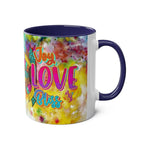 LGBTQ+ Pride Mug with vibrant rainbow design, ceramic, 11oz, glossy finish, blue handle, "Joy Love Bliss" text.