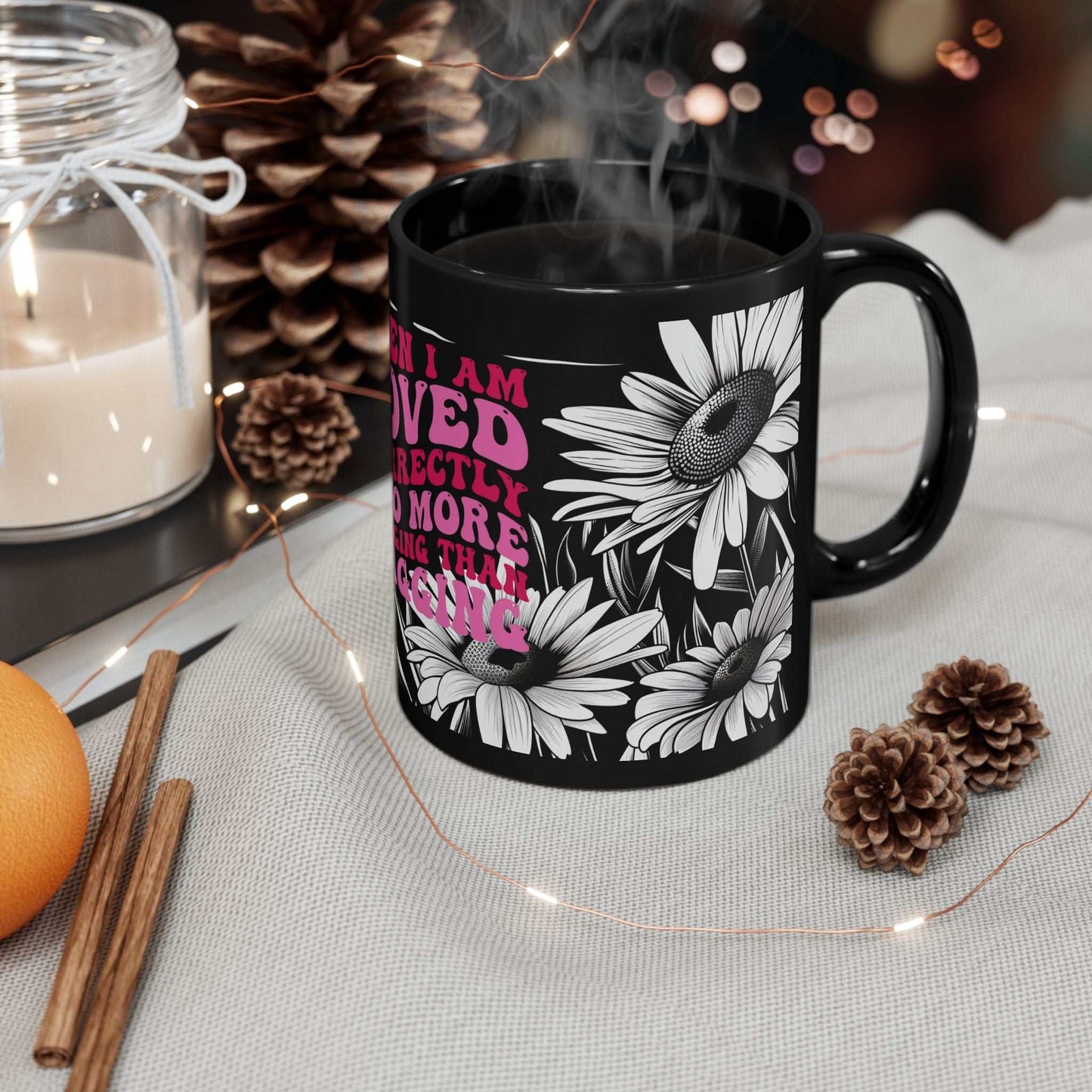 Cheeky Quote Black Ceramic Mug with playful quote and daisy design, 11oz, glossy finish, microwave and dishwasher safe.