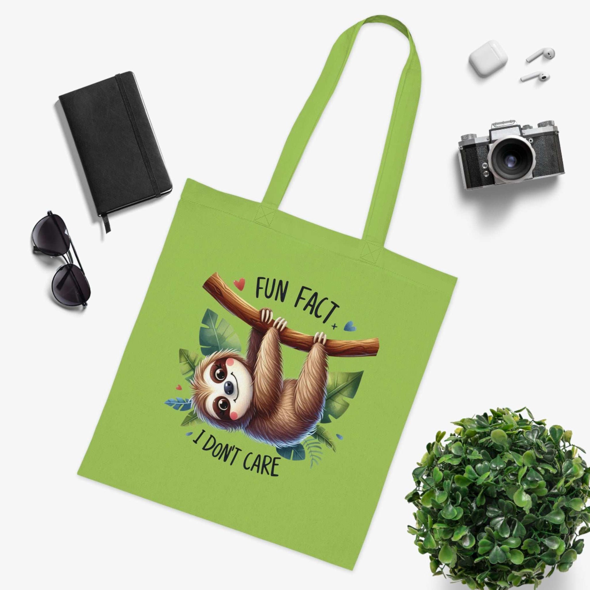 Cute sloth design cotton tote bag with vibrant colors, perfect for carrying essentials.