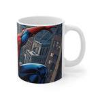 White ceramic mug featuring vibrant Spider-Man comic artwork swinging between city buildings, glossy finish, 11oz capacity, microwave and dishwasher safe.