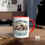Cute sloth coffee mug with "Natural Born Chiller" design on kitchen counter.