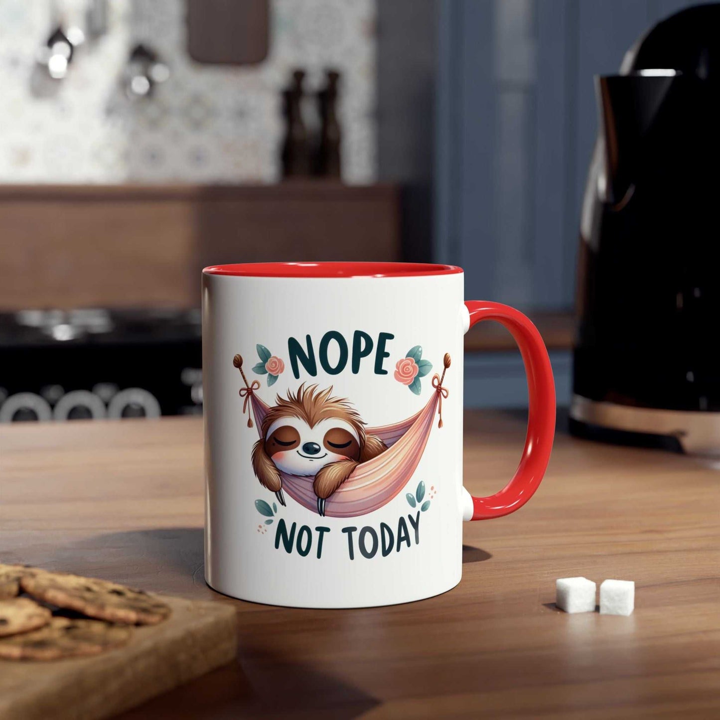 Cute sloth coffee mug with "Nope Not Today" text and red handle on kitchen counter.