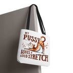 Fun stretching cat tote bag with cheeky cat design and colorful handles