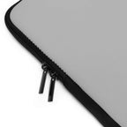 Silver laptop sleeve with dual black zipper, smooth durable neoprene and soft foam lining for protection