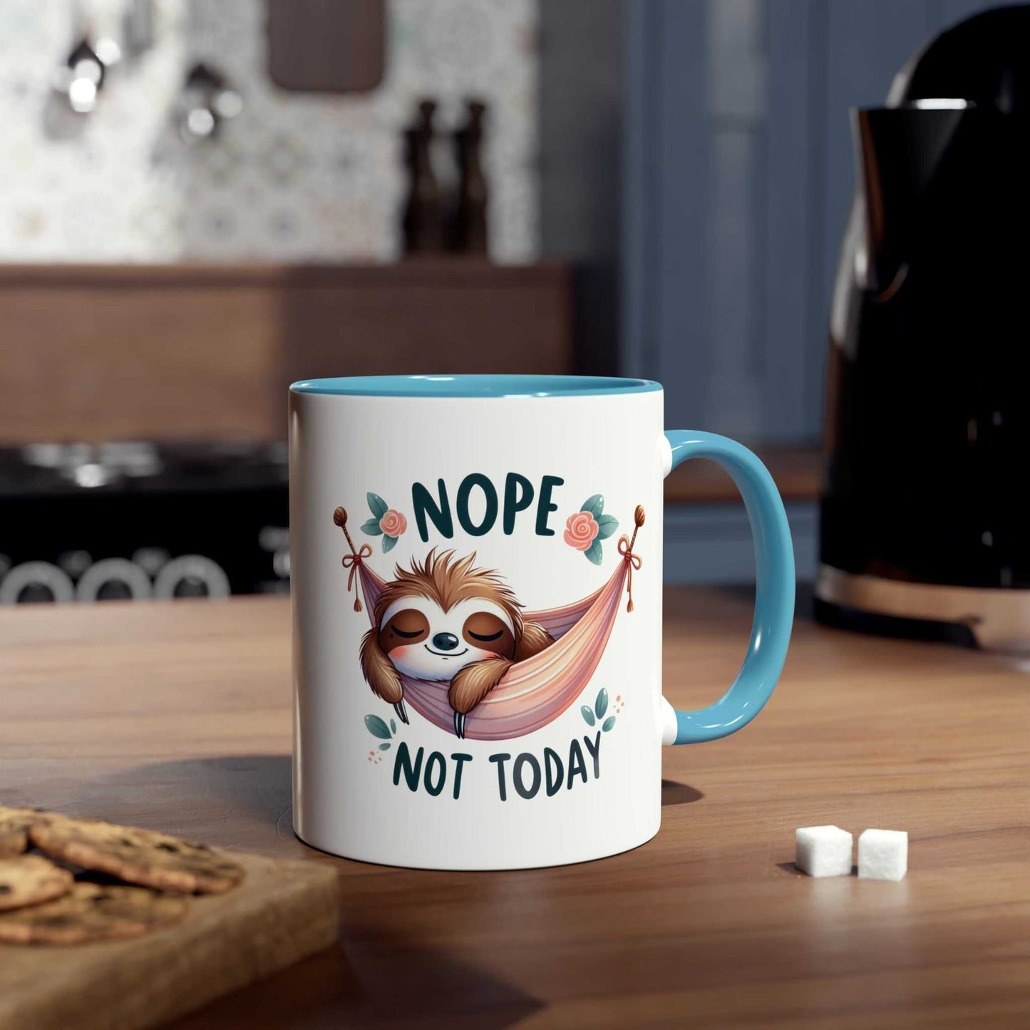 Cute sloth coffee mug with "Nope Not Today" design on kitchen counter.