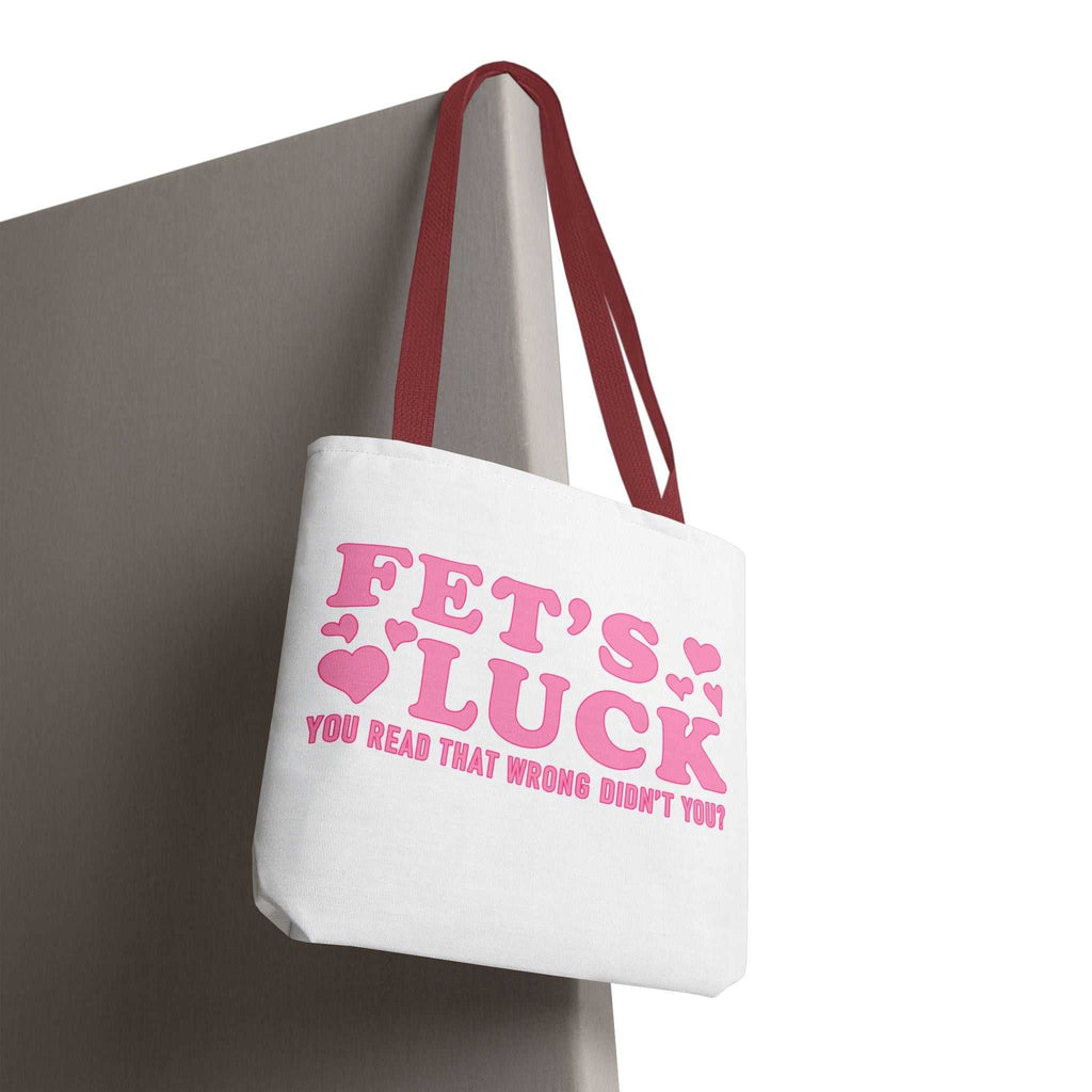 Pink heart tote bag with cheeky design and multiple handle color options