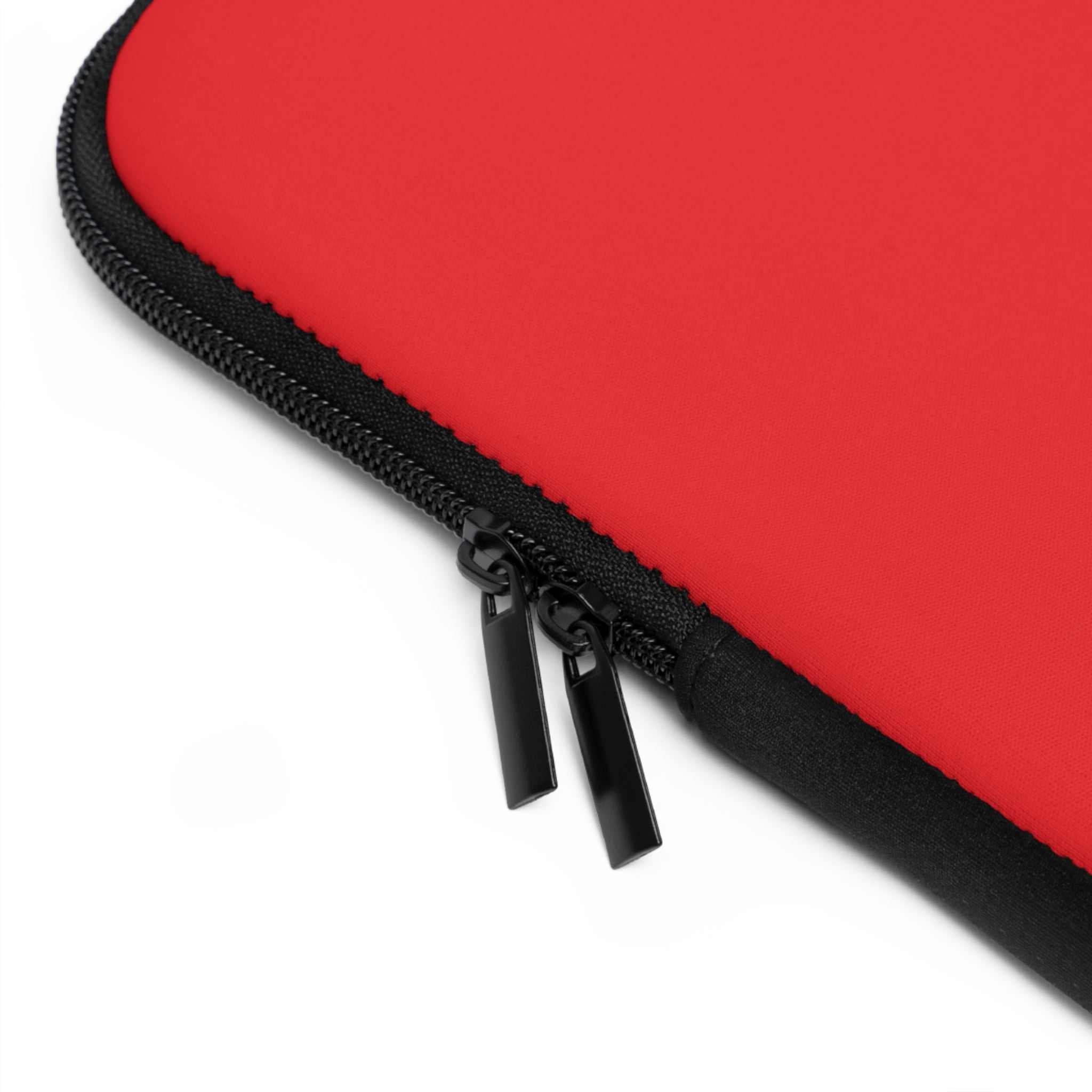 Red neoprene laptop sleeve with dual zipper and soft foam lining for protection