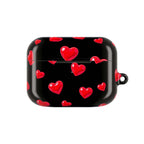 Black protective AirPods case with red hearts pattern, durable hard shell, compatible with AirPods and AirPods Pro, glossy finish