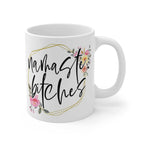 White ceramic mug with "namaste bitches" text and floral design, glossy finish, 11oz, microwave and dishwasher safe