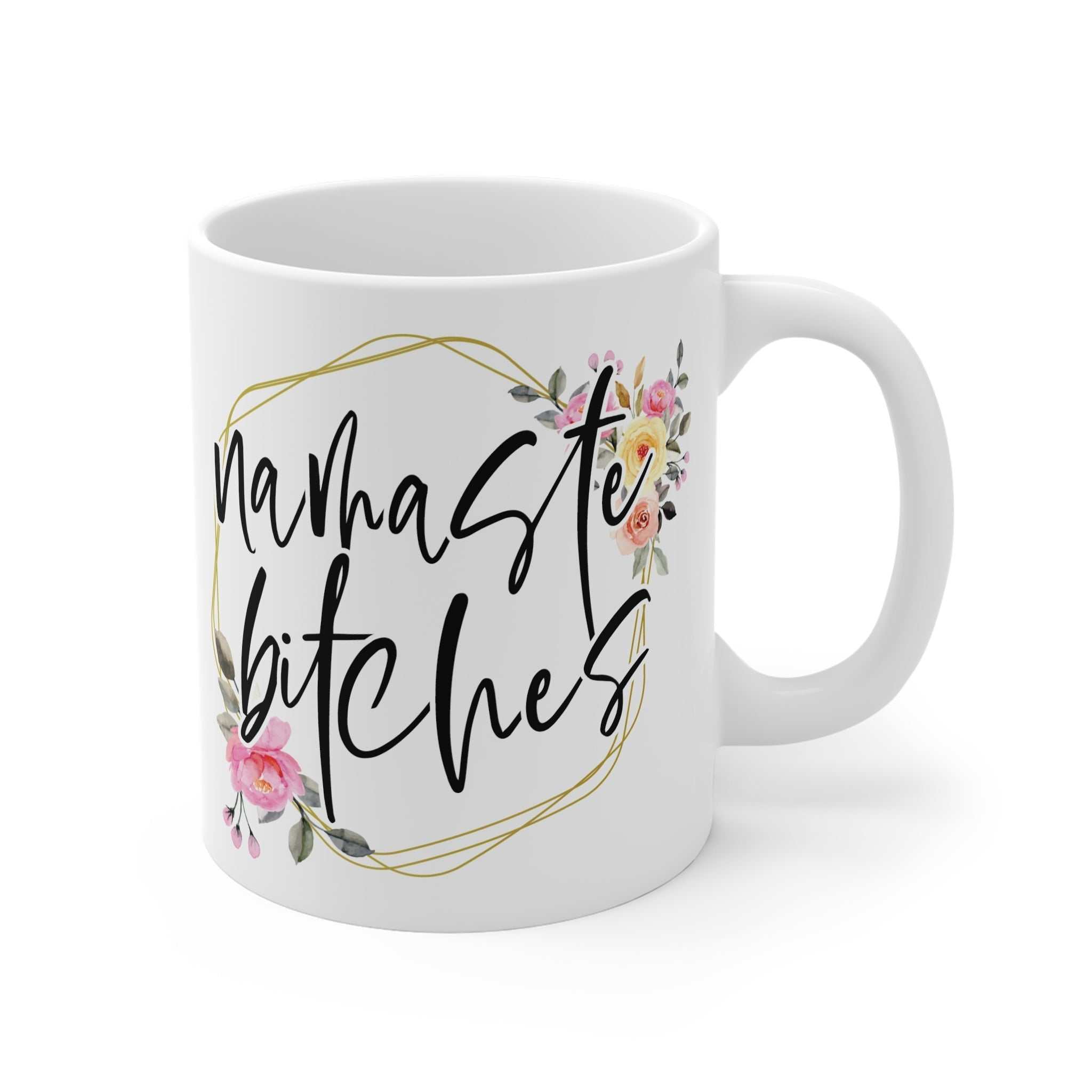 White ceramic mug with "namaste bitches" text and floral design, glossy finish, 11oz, microwave and dishwasher safe