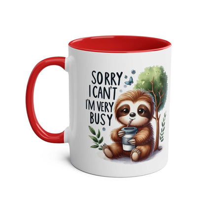 Cute sloth coffee mug with red handle and whimsical design.