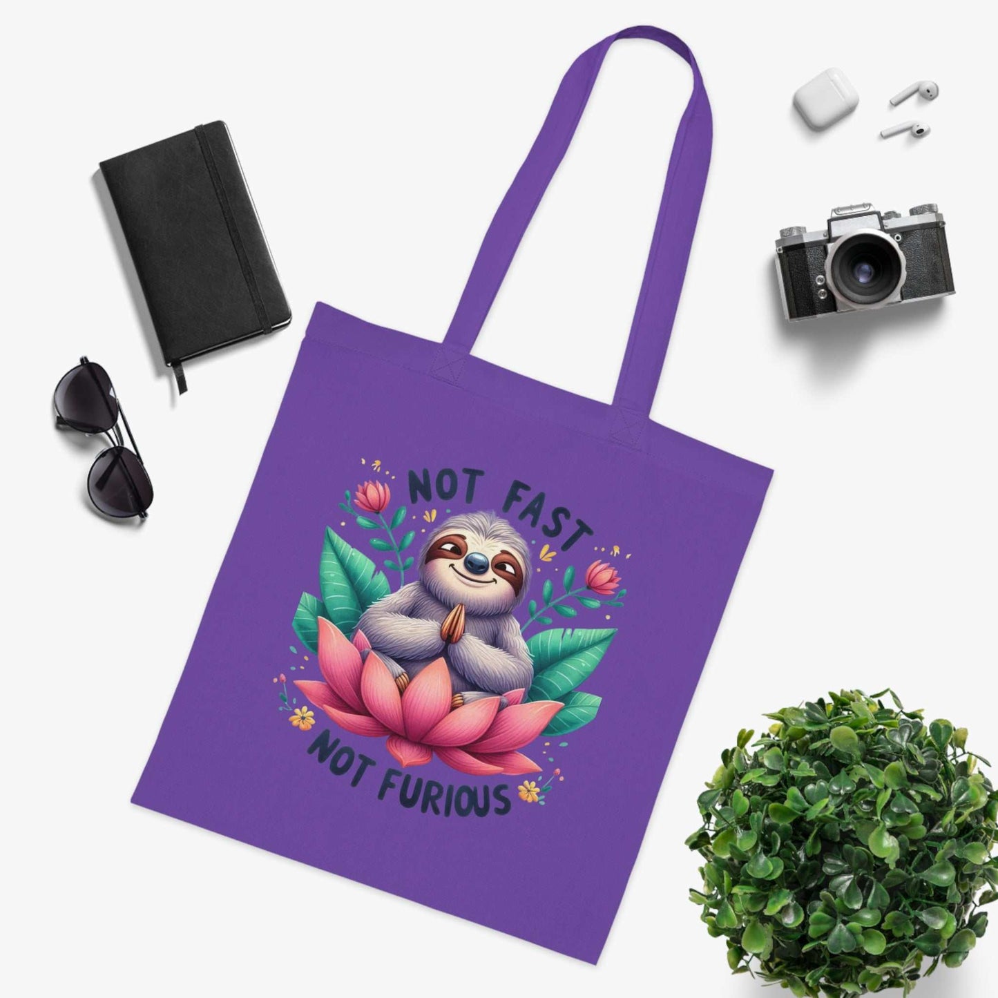 Cute sloth tote bag with vibrant design and durable cotton fabric.