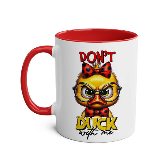 Grumpy duck design on "Don't Duck With Me" coffee mug with red handle and interior.