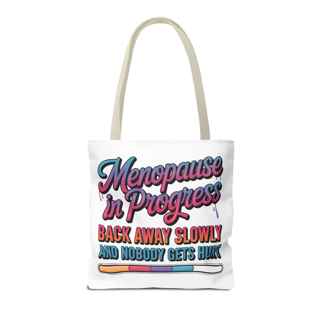 Menopause in Progress tote bag with cheeky design, durable spun polyester, and multiple handle color options