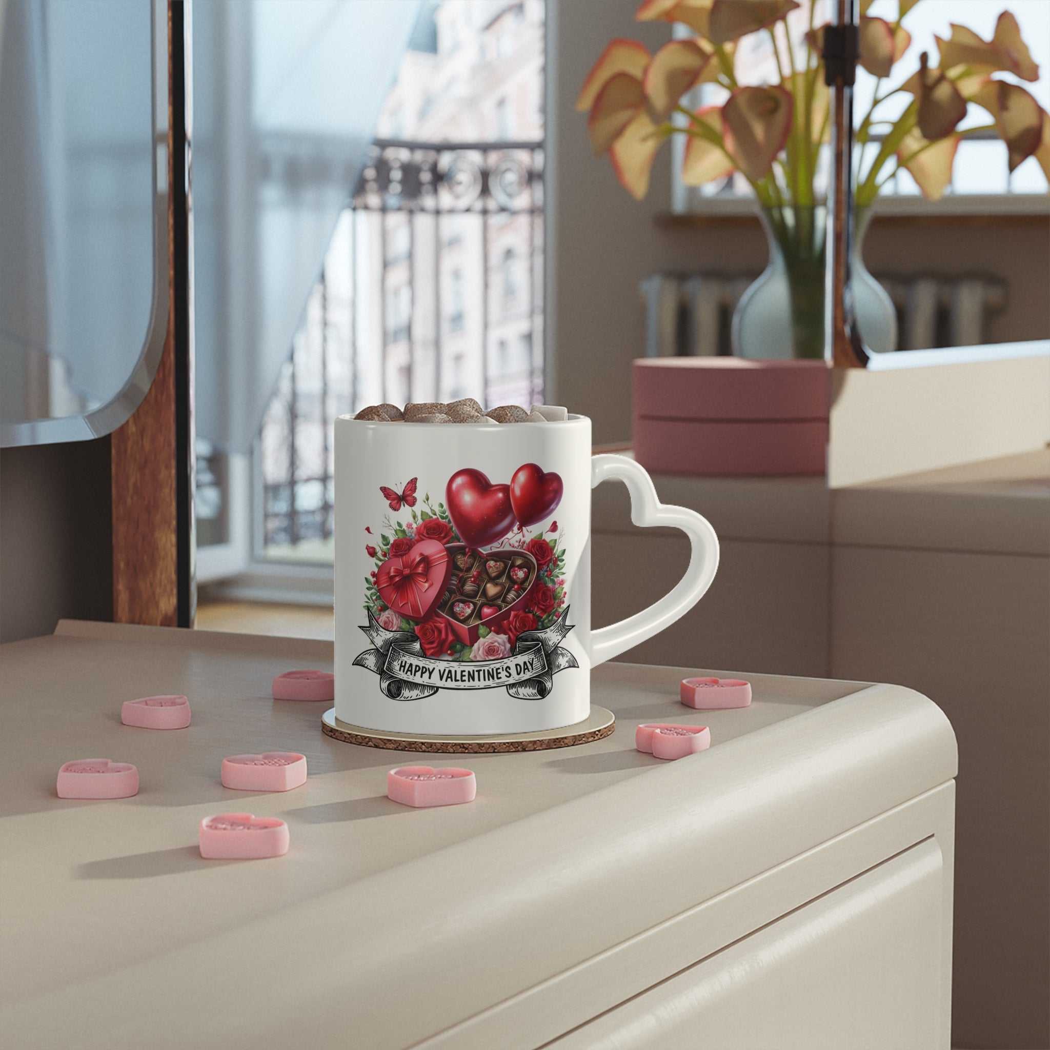 Valentine's Day mug with heart-shaped handle and vibrant design on a table.