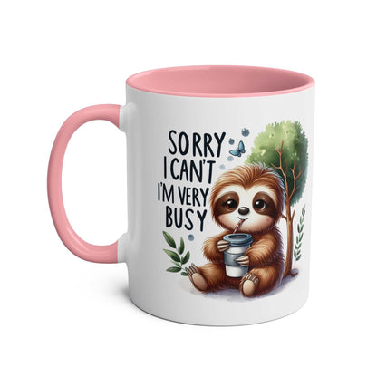 Cute sloth coffee mug with whimsical design and pink handle.