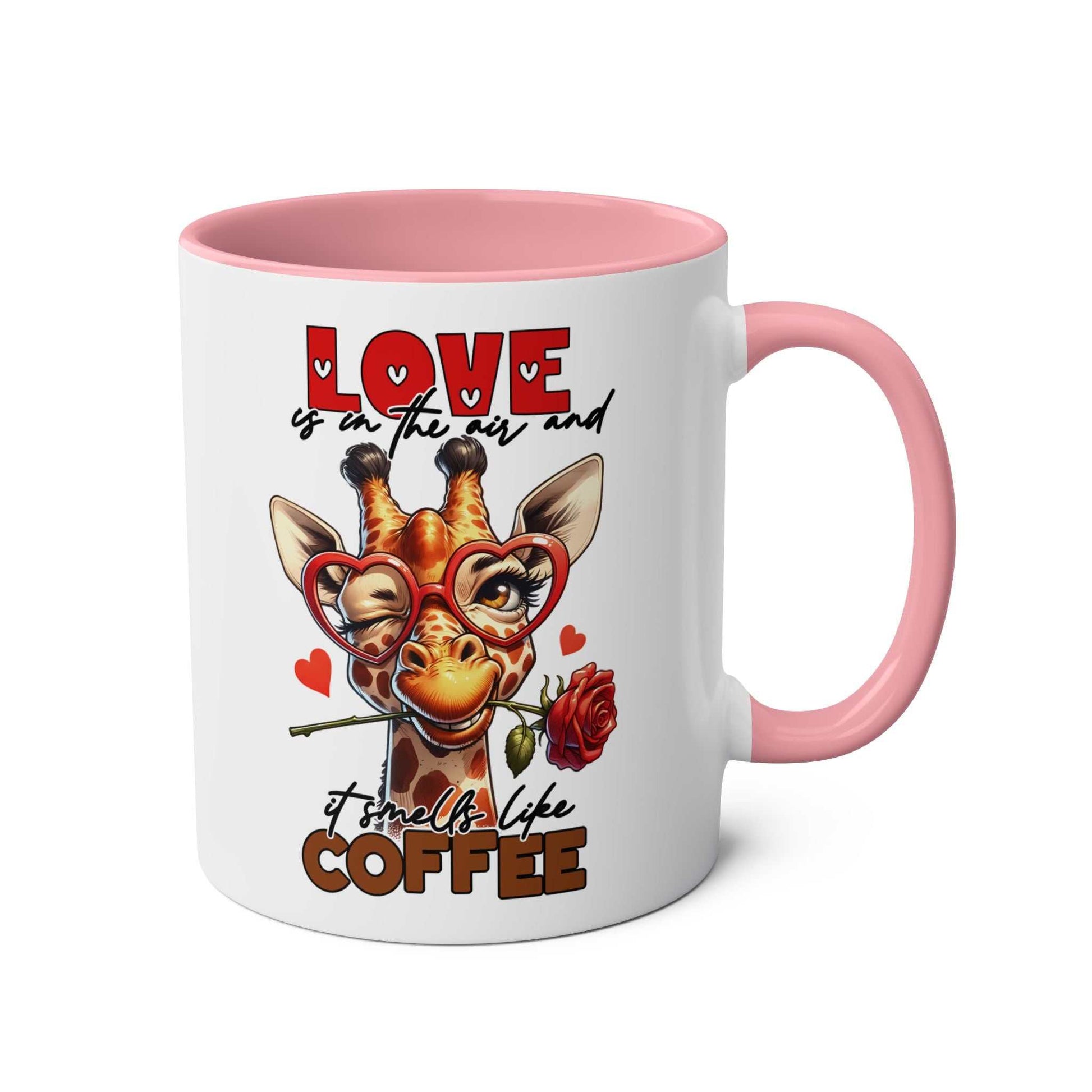 Playful giraffe design on the Smells Like Coffee Mug with a pink handle.