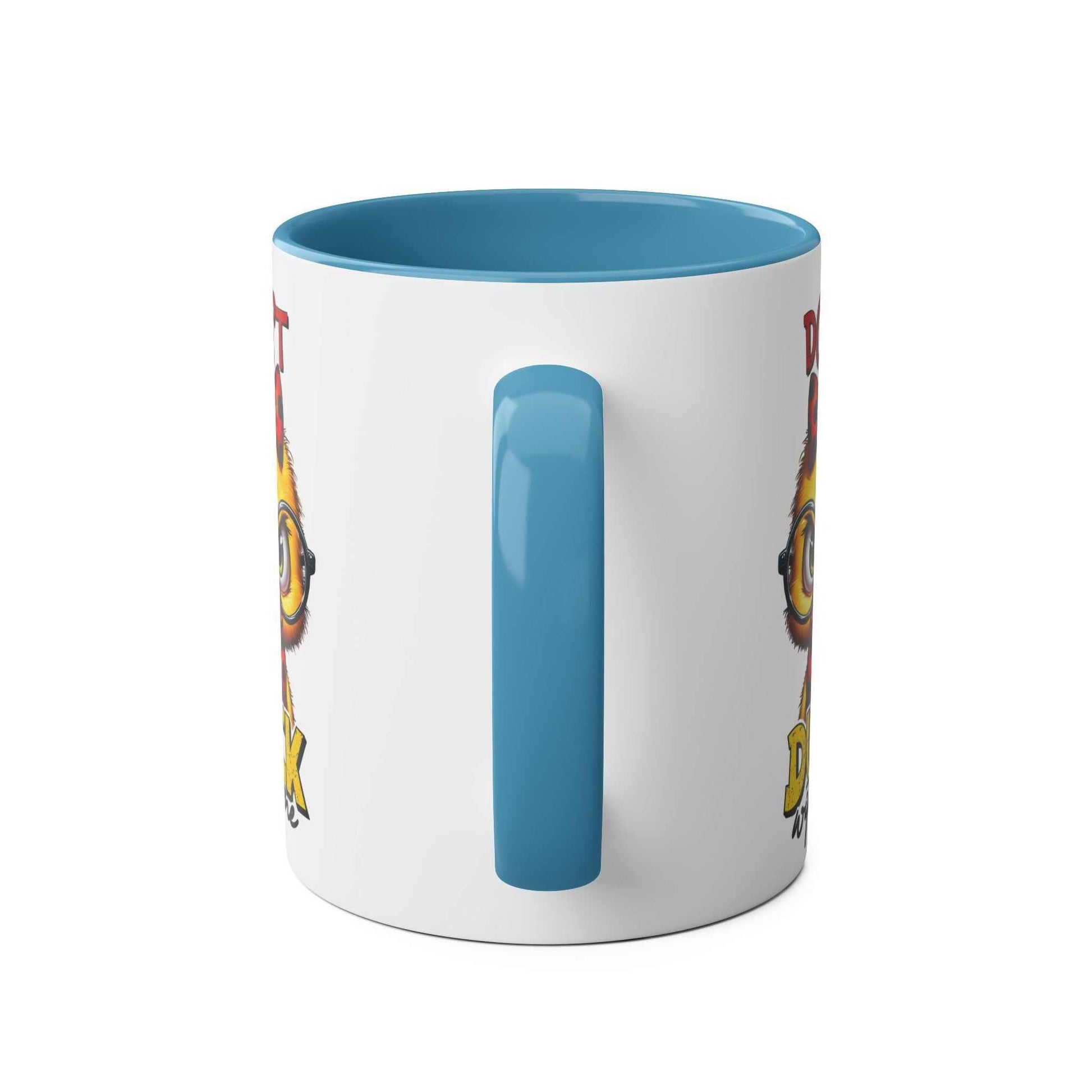 Dont Duck With Me coffee mug featuring a fun duck design with blue handle and interior.