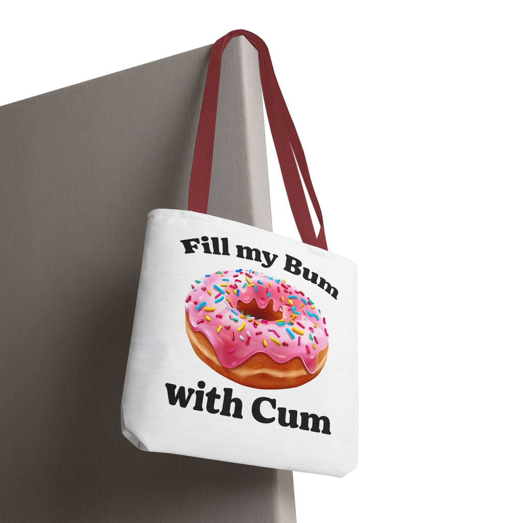 Cheeky provocative donut tote bag with bold design, durable spun polyester, multiple sizes and handle color options