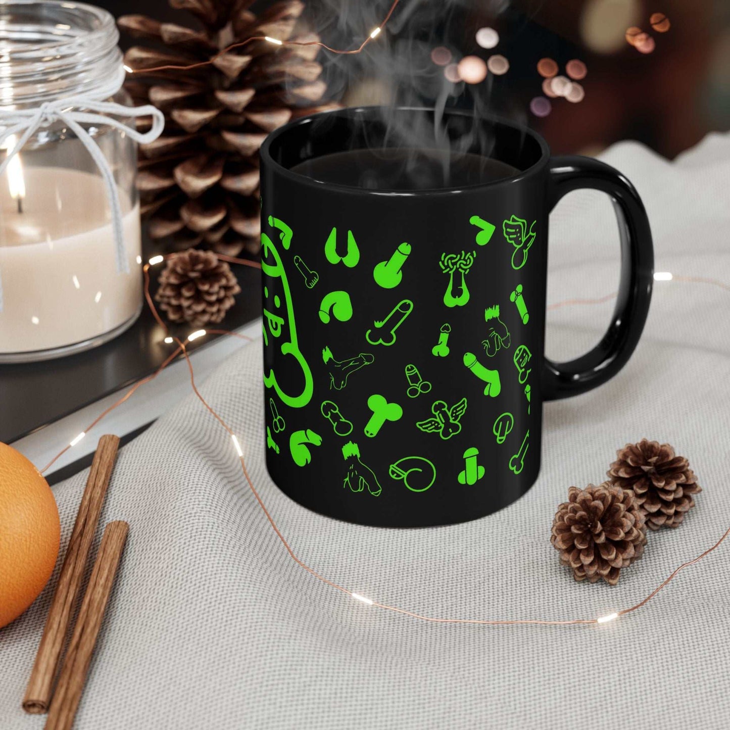 Black ceramic mug with playful green willie print, available in 11oz and 15oz sizes, glossy finish, dishwasher safe.