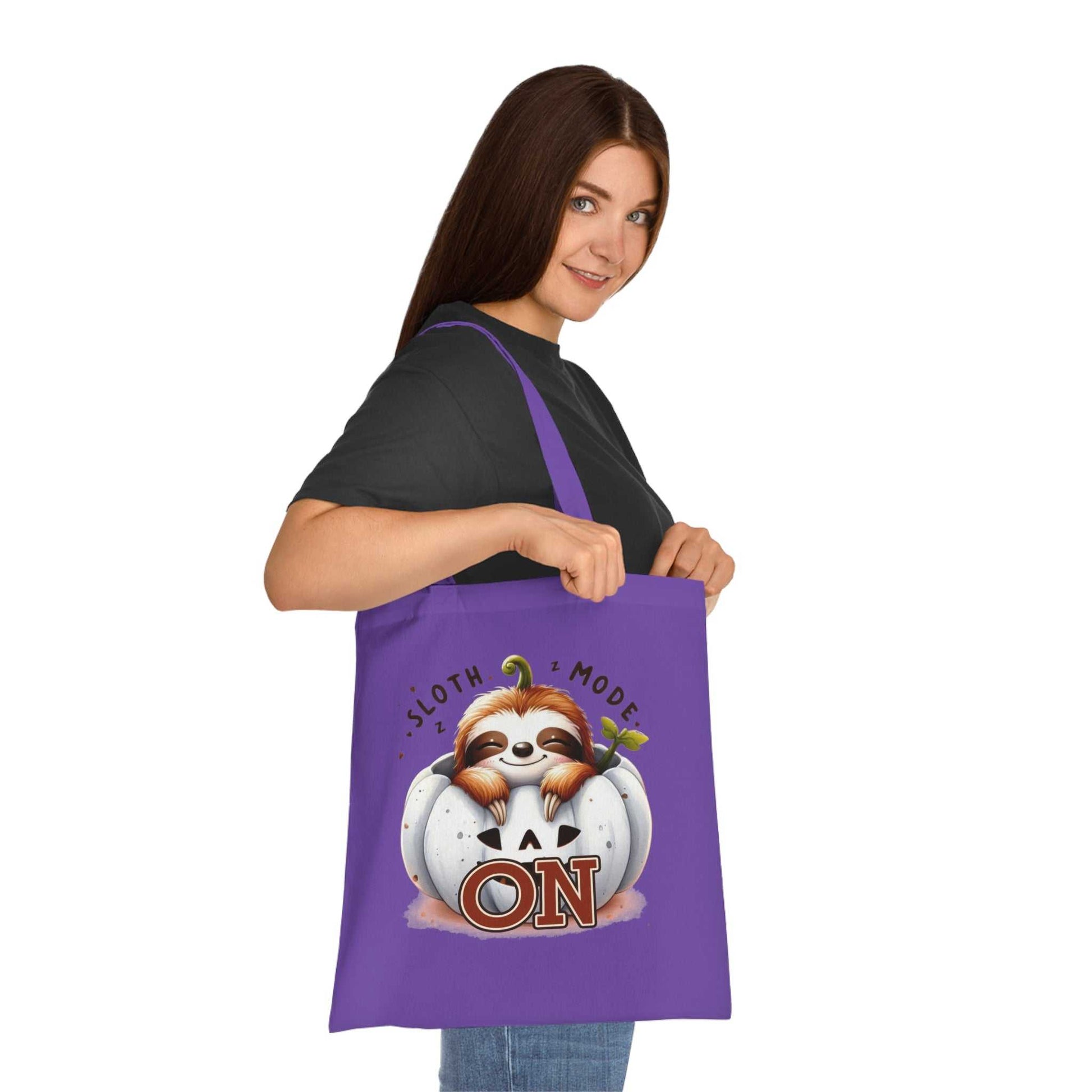 Cotton tote with cute sloth design, perfect for shopping and essentials, 100% cotton fabric.