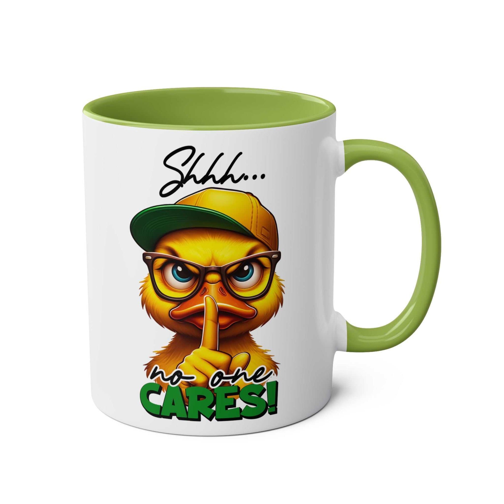 Duck design "No One Cares" coffee mug with green handle.