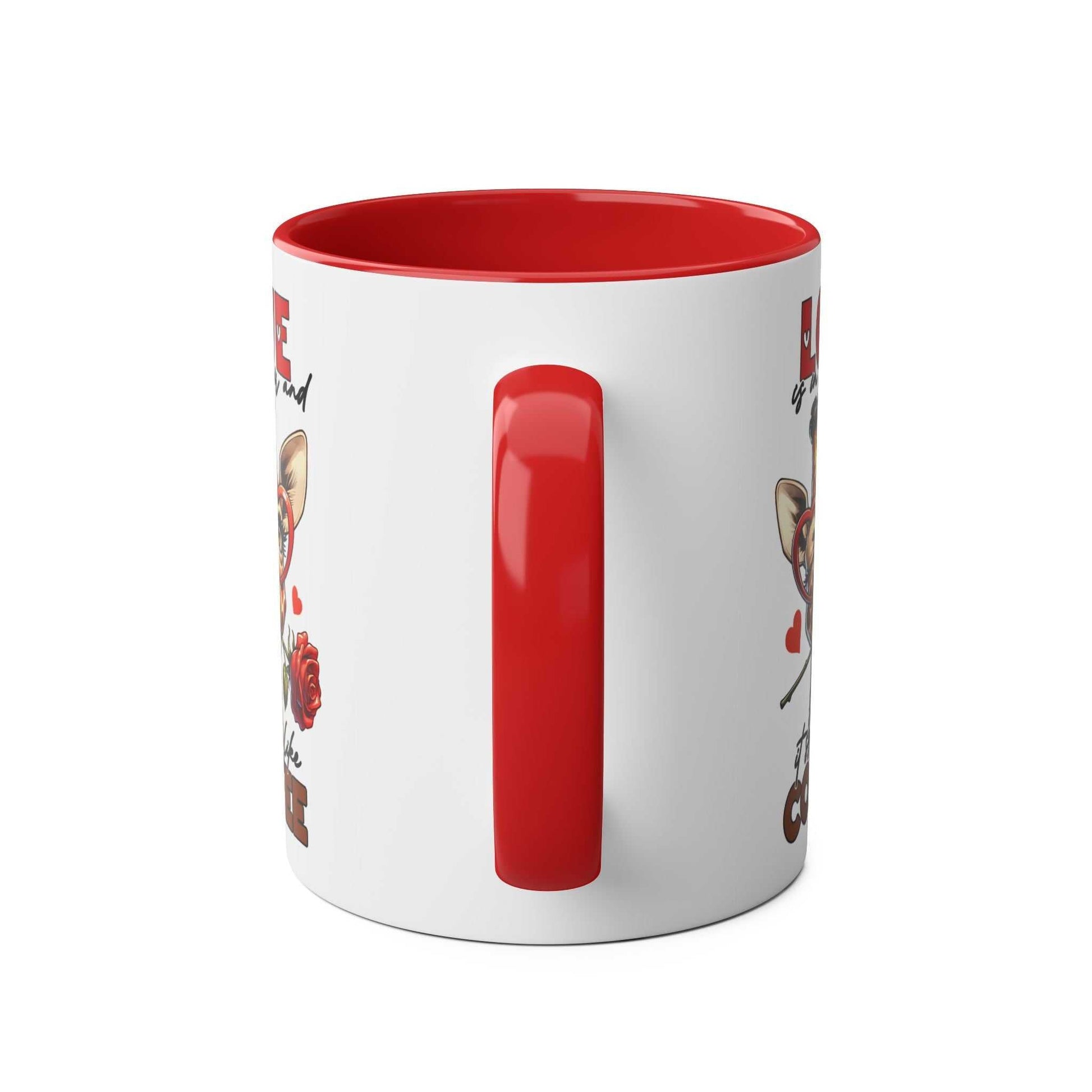 Ceramic coffee mug with playful giraffe design, red handle, and interior.