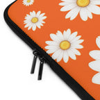Orange daisy laptop sleeve with dual zipper, durable neoprene, soft foam lining, and waterproof protection