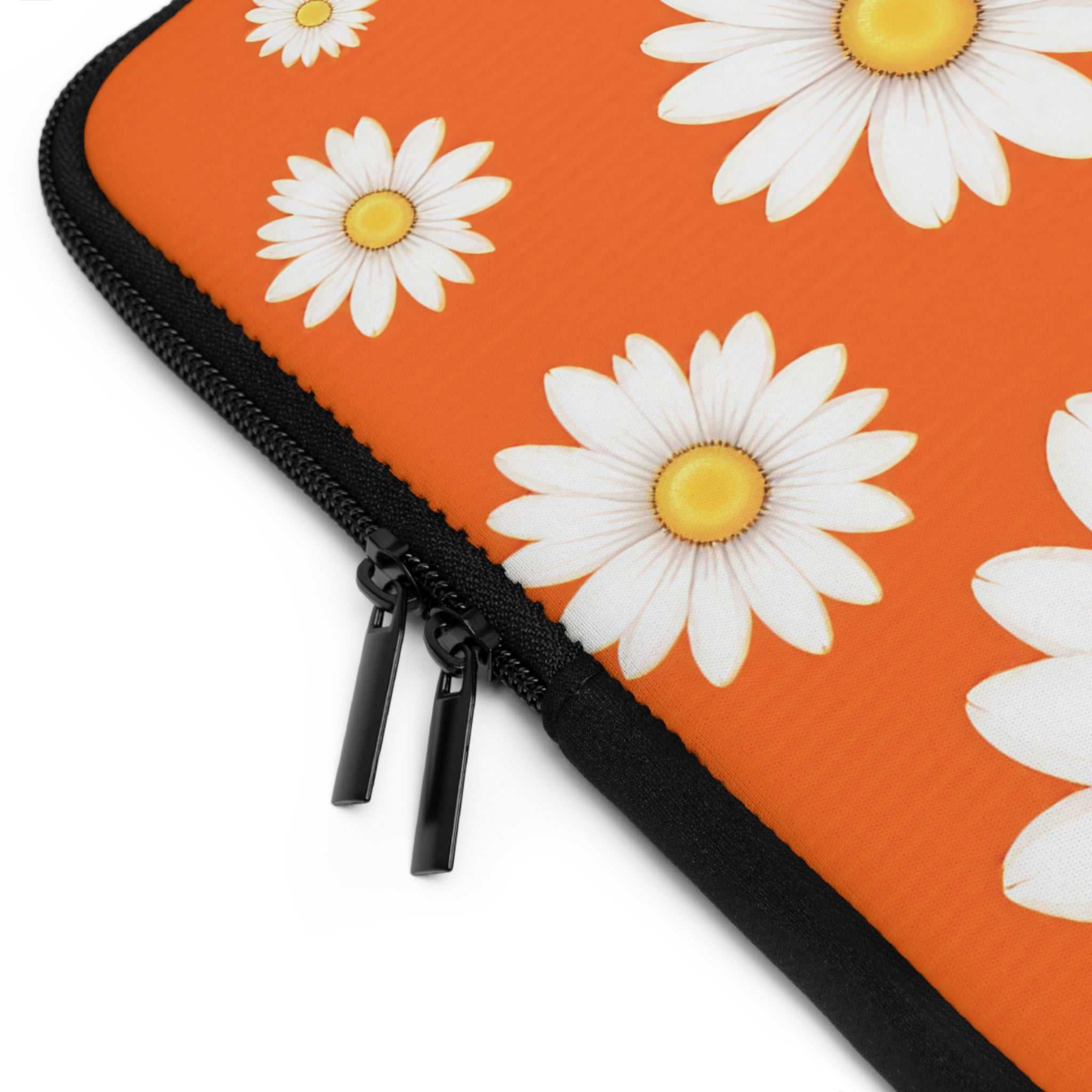 Orange daisy laptop sleeve with dual zipper, durable neoprene, soft foam lining, and waterproof protection
