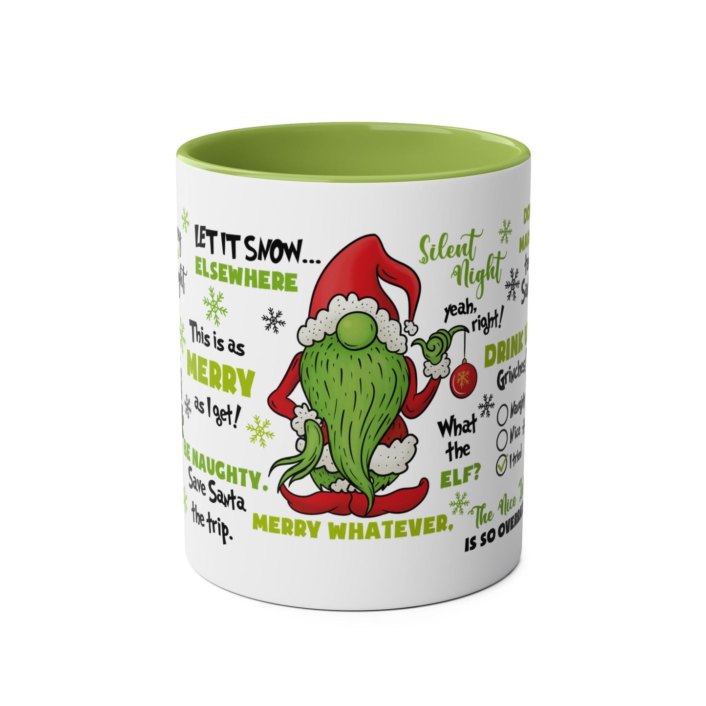 Grinch-themed ceramic Christmas mug with green interior and festive text.