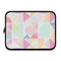 Pastel geometric print neoprene laptop sleeve with soft foam lining and dual zipper closure.