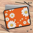Orange daisy laptop sleeve with vibrant orange background and white daisy flowers, neoprene protective case with dual zipper.