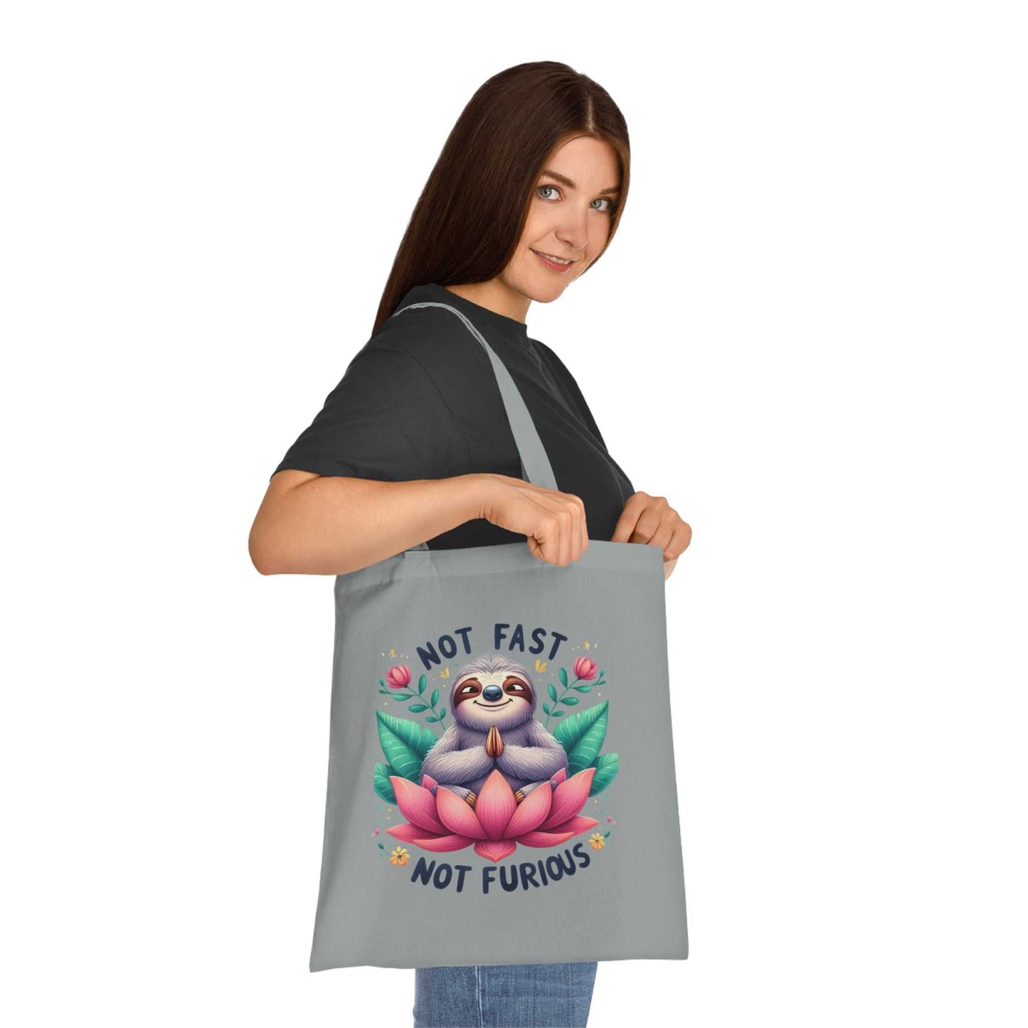 Cotton tote bag with cute sloth design, vibrant colors, 100% cotton fabric, reinforced handles.