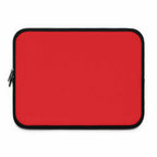 Red neoprene laptop sleeve with soft foam lining and dual zipper closure, lightweight and waterproof protection for laptops.