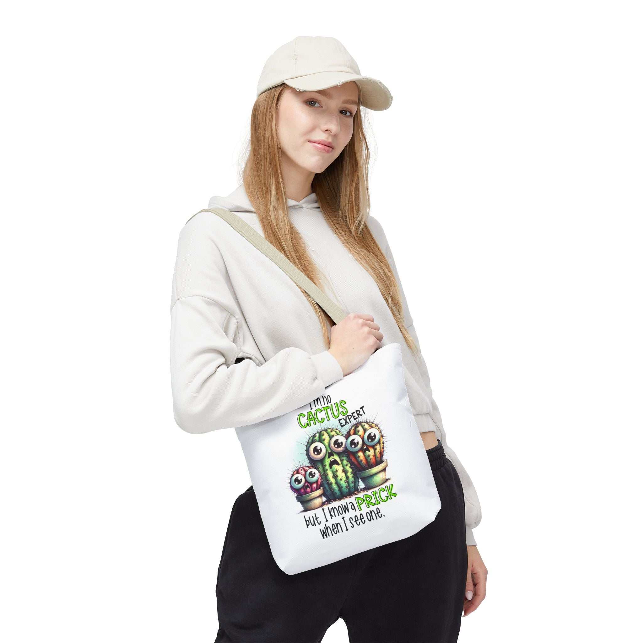 Fun cactus tote bag with cheeky design and colorful handles, available in three sizes, made of durable spun polyester.